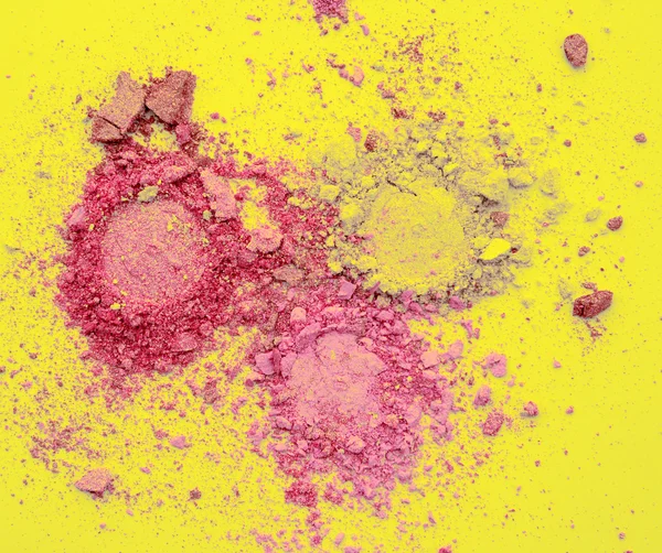 Πολύχρωμο σκόνη σε κίτρινο φόντο — Φωτογραφία Αρχείου