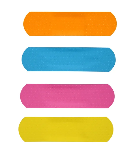 Zbiór różnych kolorów tynków lub bandaż na białym tle na białym tle (ścieżki przycinającej) — Zdjęcie stockowe