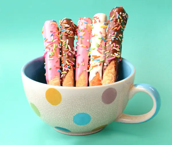 Colorful cake pops stick in polka dot cup — Stock Photo, Image