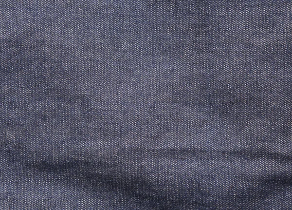 Вид крупным планом на абстрактное пространство пустой синей текстуры джинсов — стоковое фото