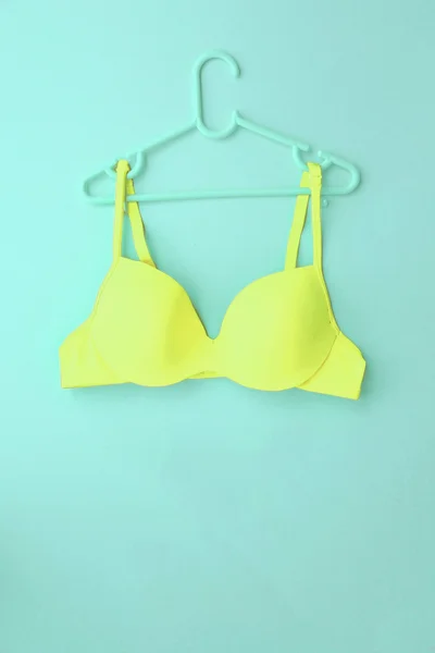 Summer concept, bra on coat hanger on blue. (Pop art style) — Stock Photo, Image