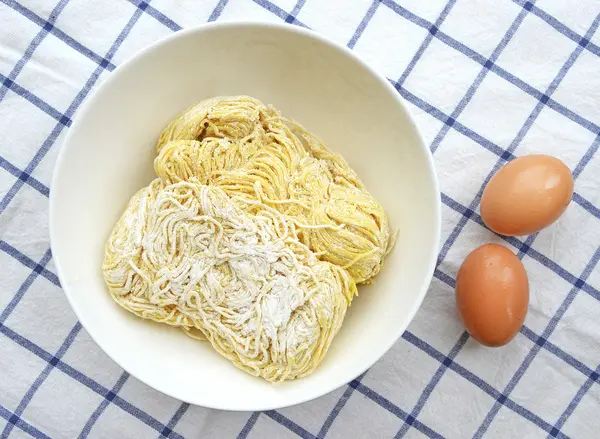 Homemade noodles on kitchen table — Stock Photo, Image