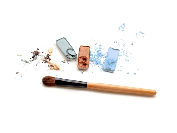 Multicolored crushed eyeshadows with brush isolated on white background — Stock Photo, Image