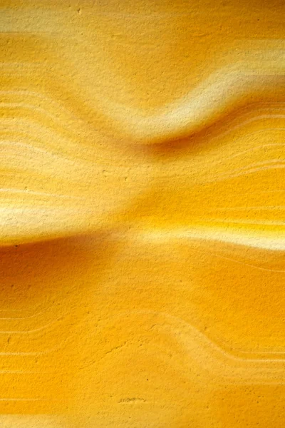 曲線の背景を持つ黄色いセメント — ストック写真