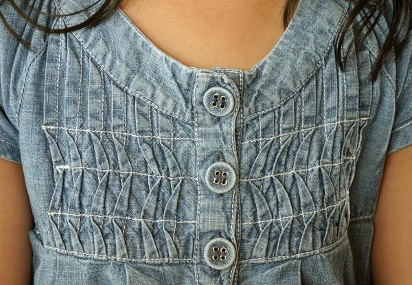 Little girl wears jeans dress close up — Stock Photo, Image