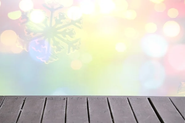 Christmas winter background with wooden table and blurred bokeh — Stock Photo, Image