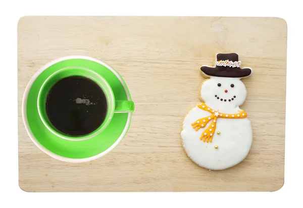 Koffie beker en sneeuwpop cookie — Stockfoto