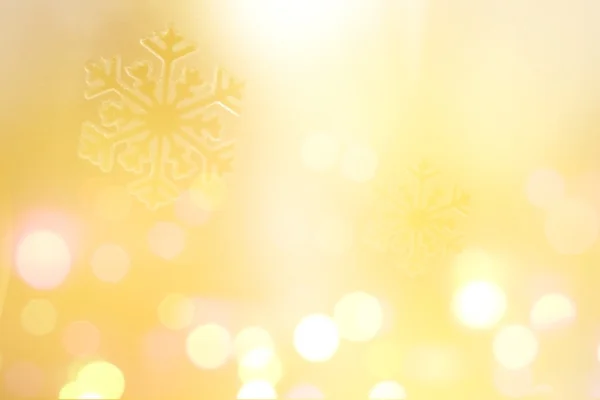 Snowflake on glitter yellow background — Stock Photo, Image