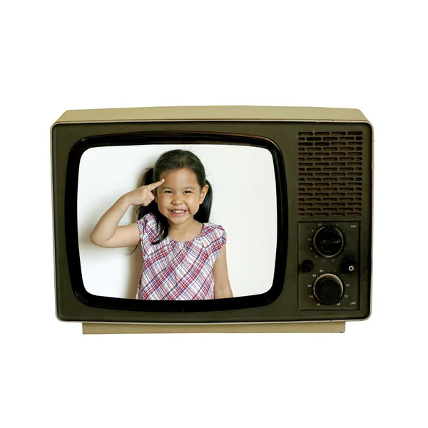 Mała dziewczynka wewnątrz stary telewizor retro — Zdjęcie stockowe