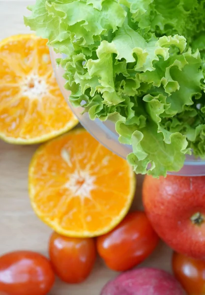 Fresh lettuce, tomato and orange — Stock Photo, Image