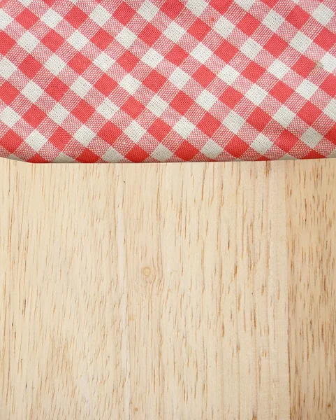 Ubrus piknik na starý dřevěný stůl pohled shora — Stock fotografie