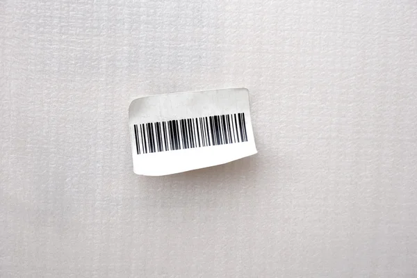 Small bar code label stick on white background — Stock Photo, Image