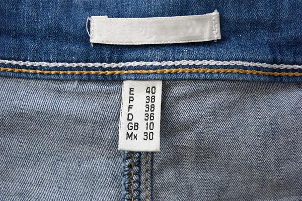 Rótulo sobre a composição do jeans — Fotografia de Stock