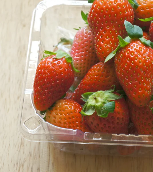 Close up of fresh strawberries in plastic pack — Stock Photo, Image