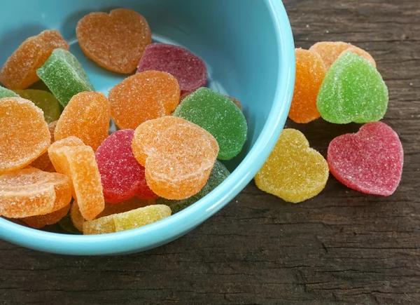 Fruit jelly hearts on wooden table — Stock Photo, Image