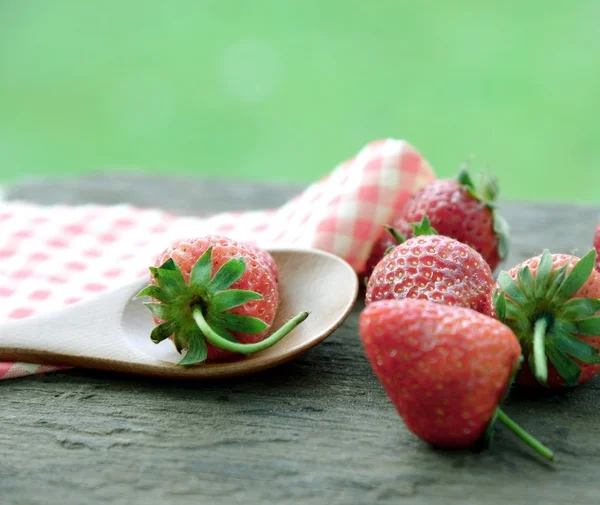 Strawberries in wooden spoon — Stock Photo, Image