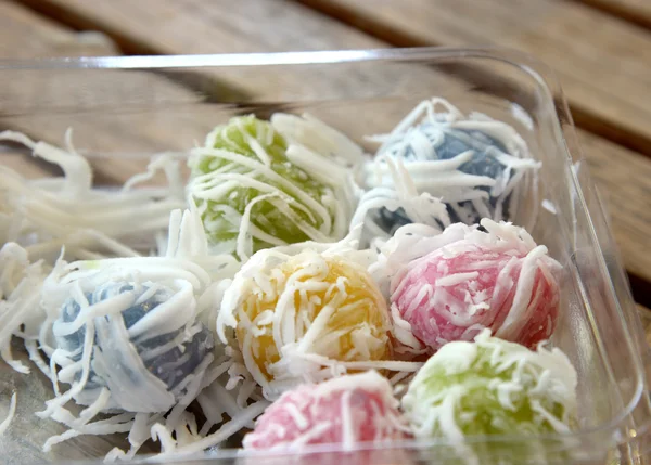 Thai dessert, sweet boiled ball dessert, roll over the grated coconut — Stock Photo, Image