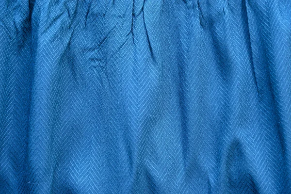 Creased blue cloth material fragment as a background texture — Stock Photo, Image