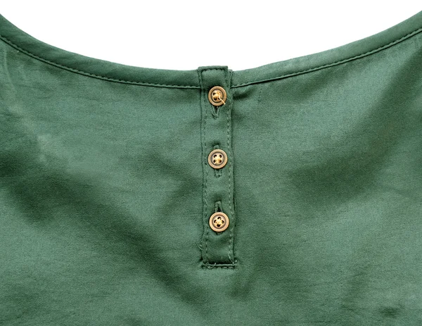 Guldfärgade knappar på Green Silk tyg — Stockfoto