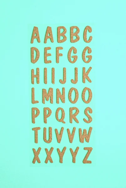青の背景に木製アルファベット — ストック写真