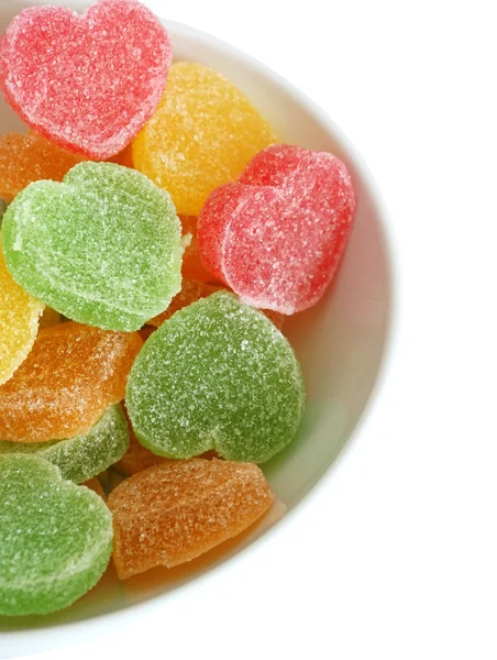 Heart-shaped candies in bowl — Stock Photo, Image