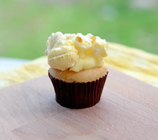 Cupcake with popcorn on top. — Stock Photo, Image
