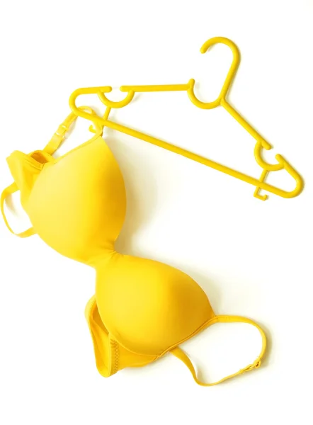 Summer concept, yellow bra on coat hanger on white. (Pop art style) — Stock Photo, Image