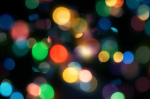 Luzes desfocadas fundo bokeh da festa de Natal noite para o seu design, cor retro tonificado — Fotografia de Stock