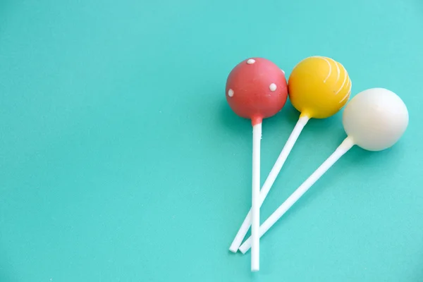 Cake pops on blue background — Stock Photo, Image