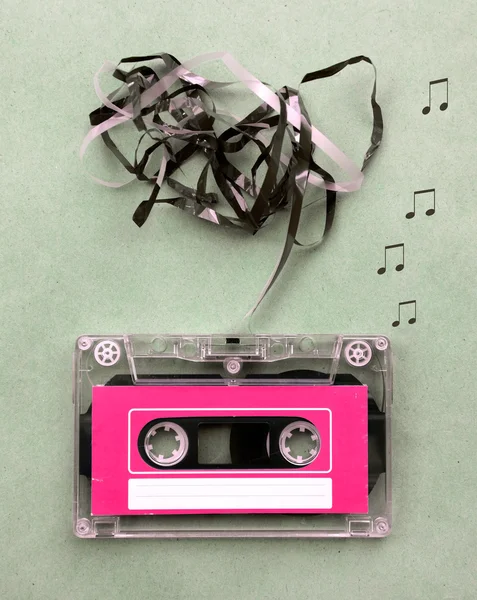 Vintage looking Magnetic tape cassette for audio music recording with song note blow out — Stock Photo, Image