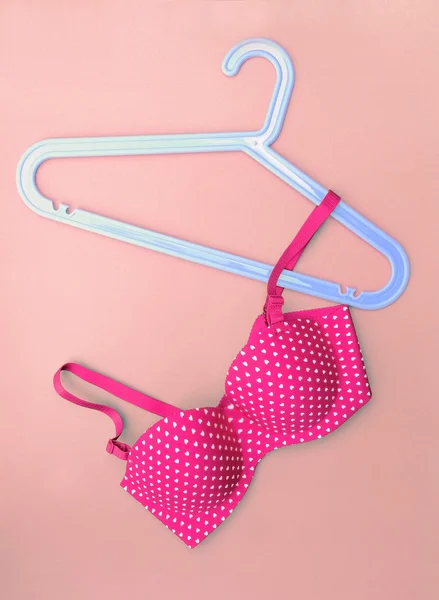 Summer concept, bra on coat hanger on blue. (Pop art style) — Stock Photo, Image