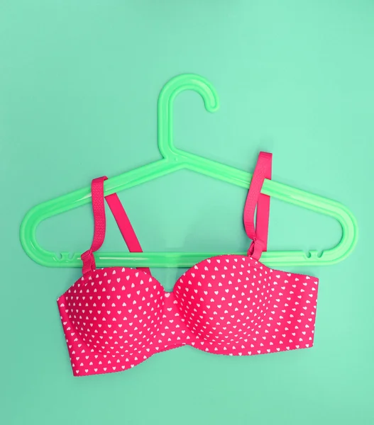 Summer concept, bra on coat hanger on blue. (Pop art style) — Stock Photo, Image