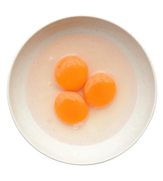 Яйцо желток и белый в миске изолированы на белом (вырезка путь ) — стоковое фото