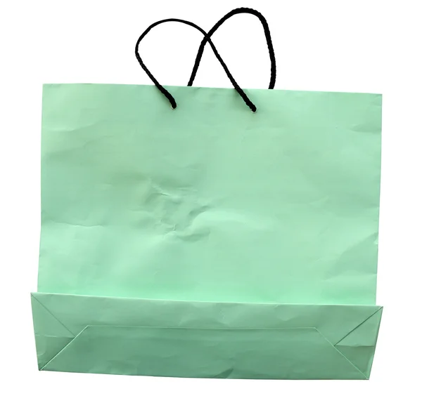 Sac en papier vert isolé sur blanc avec chemin de coupe . — Photo