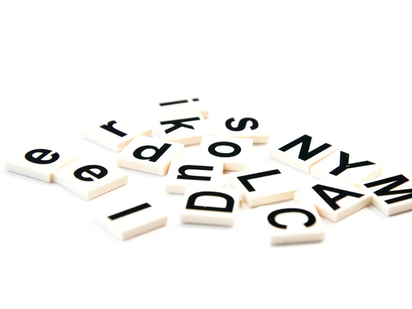 Muchos bloques de alfabetos sobre fondo blanco — Foto de Stock