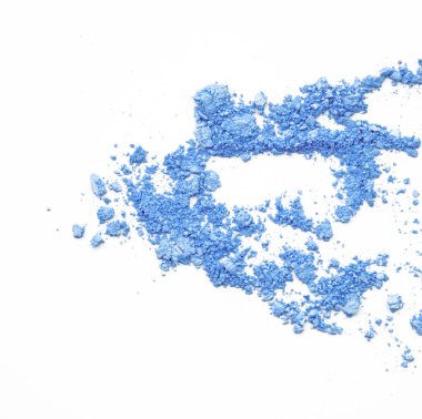 crushed makeup on white background. The eye shadows
