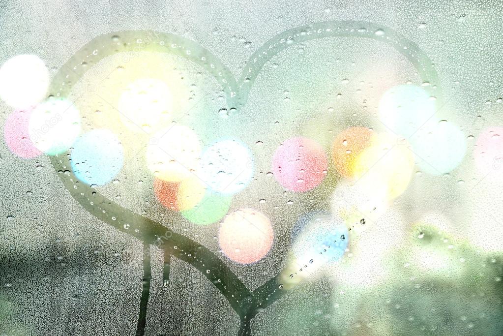 Autumn rain, draw heart on glass - love concept
