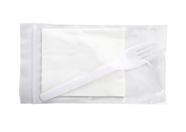 Paper napkin and fork isolated on white background — Stock Photo, Image