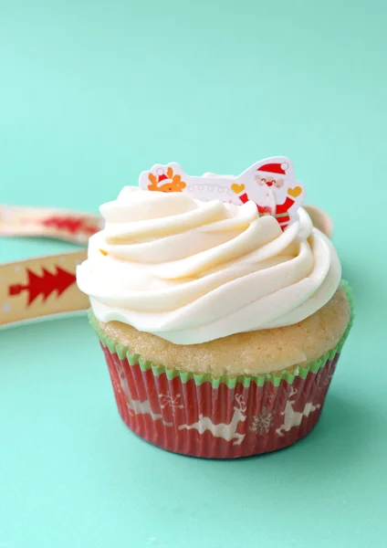 Christmas Cupcake on blue background — Stock Photo, Image