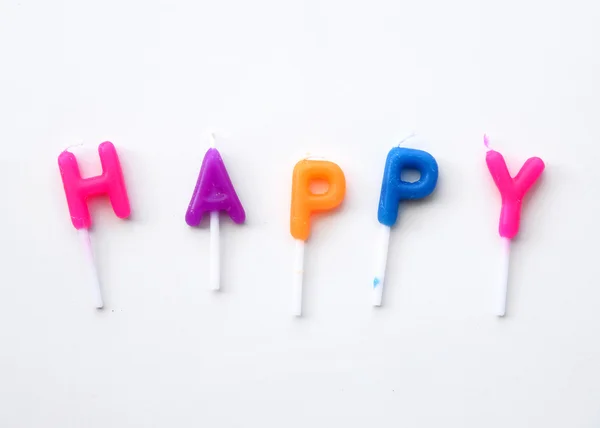 Candle made word Happy on white. — Stock Photo, Image