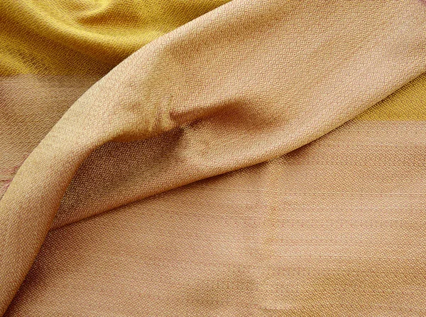 Silk golden fabric texture — Stock Photo, Image