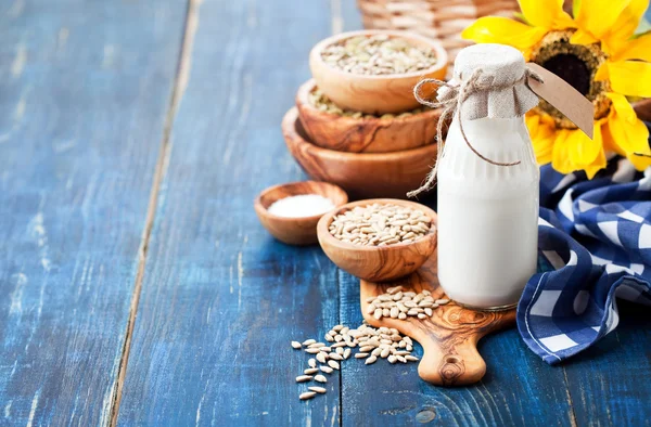 Raw vegan sunflower seed milk in glass bottle — Stock Photo, Image