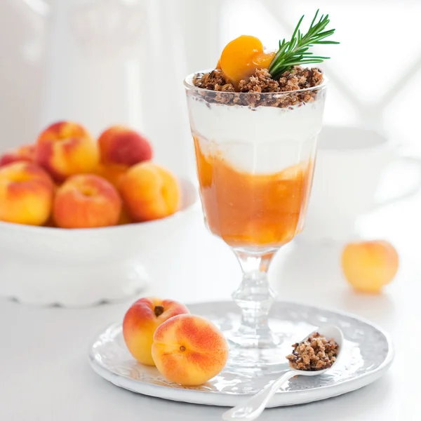 Yogurt with granola and apricots — Stock Photo, Image