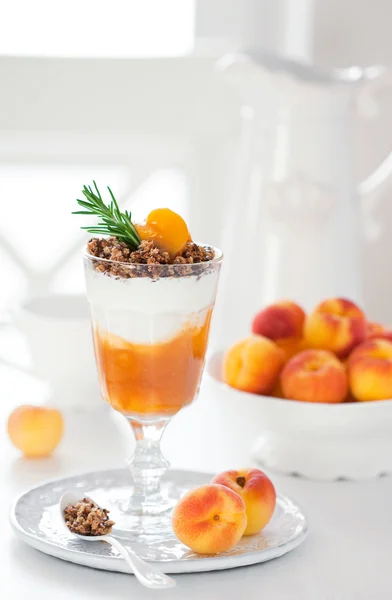 Yogurt with granola and apricots — Stock Photo, Image