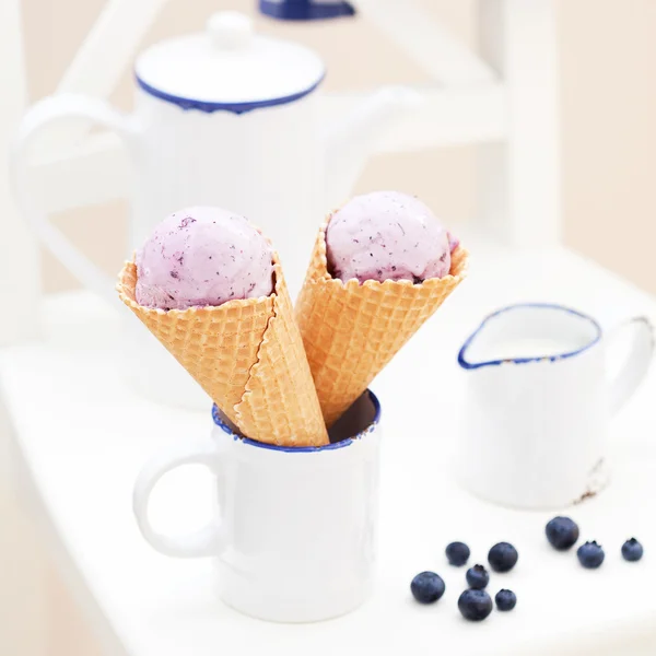Blueberry ice cream in waffle cones — Stock Photo, Image