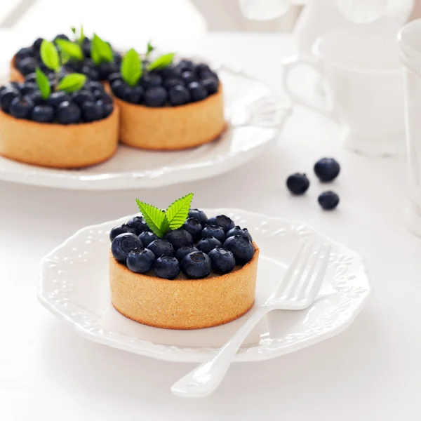 Tartlets com creme e mirtilos — Fotografia de Stock