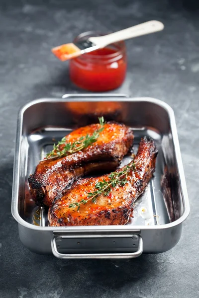 Baked pork with chili sauce — Stock Photo, Image