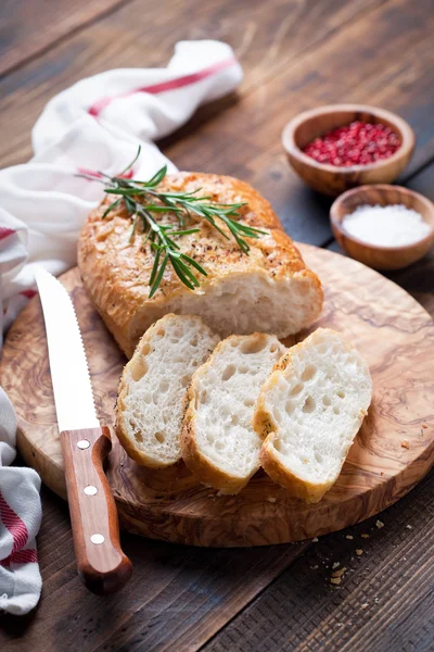 Ciabatta with rosemary   on  board — Stock Photo, Image