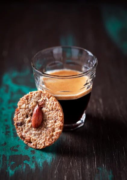 Glass of espresso and cookie — Stock Photo, Image