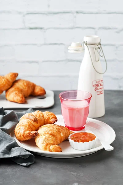 Croissants, jam and milk — Stock Photo, Image